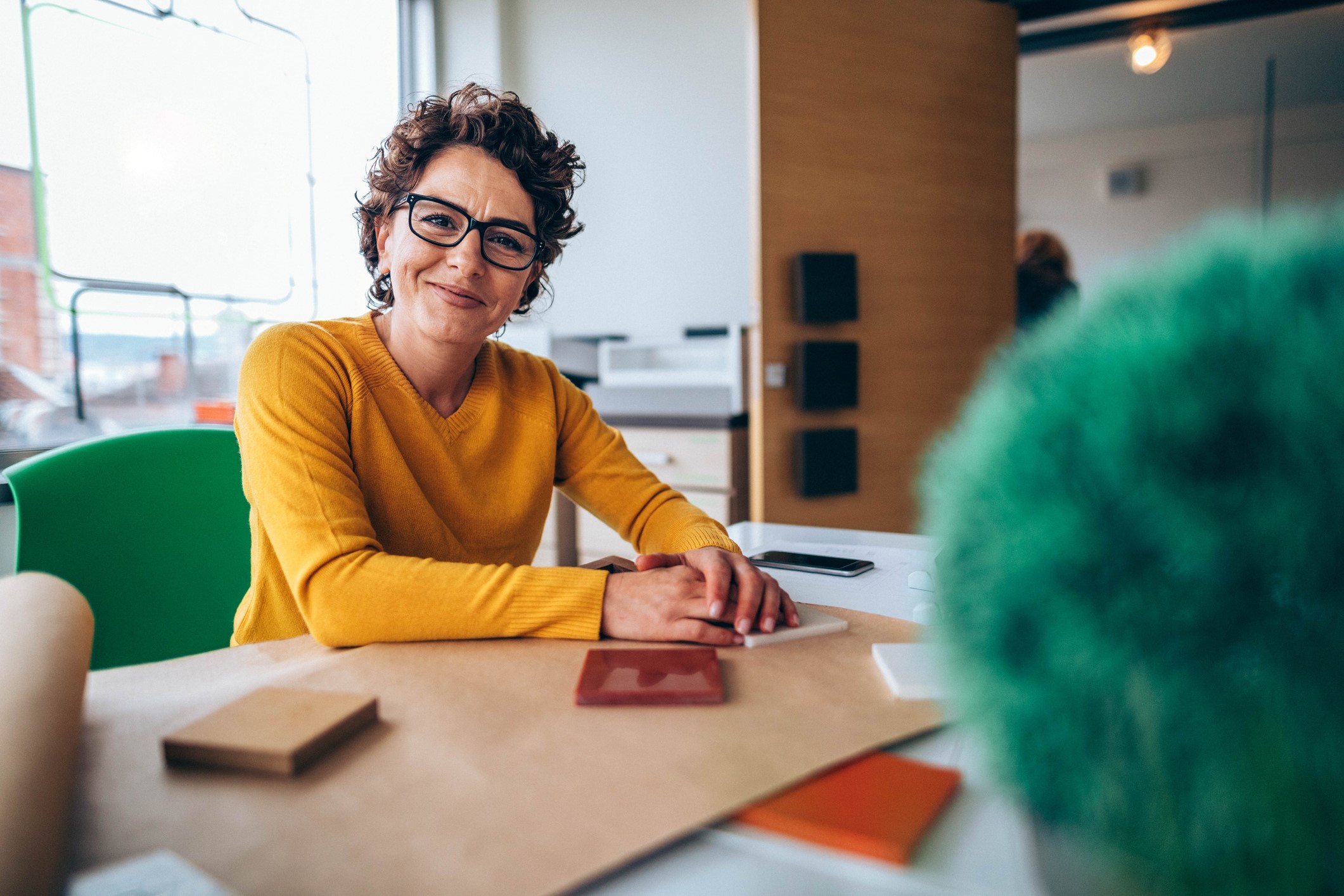 Middle aged woman smiling at work